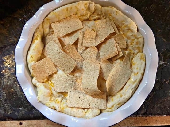 Add Corn Chips or Tortilla chips to the bottom of the pie