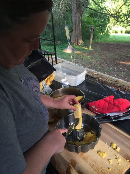 Cutting the corn from the cob. I use a knife, sweet hubby uses the corn shaver