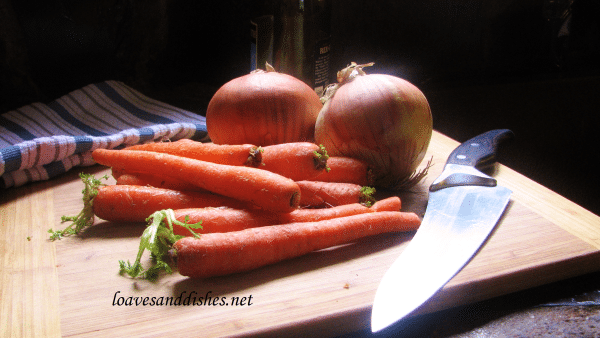 A photo of onions and carrots ready to go in the Delicious, Easy and Perfect Pot Roast & Daddy’s Drooling Again Gravy