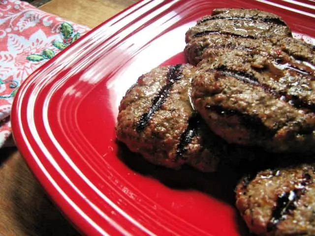 red plate of grilled hamburgers