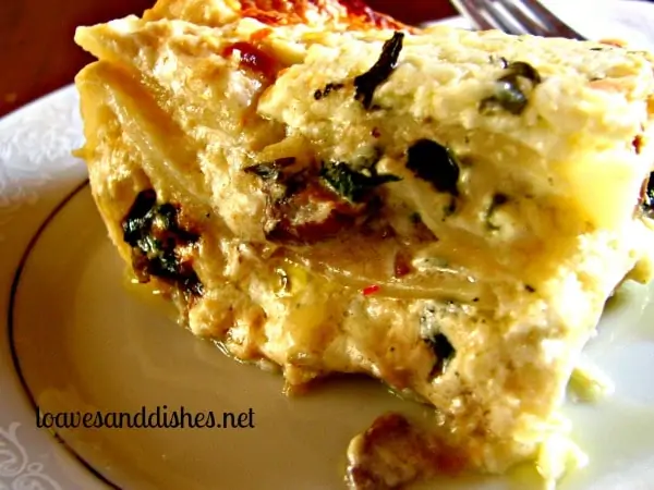 Mushroom Lasagna with white sauce and fork