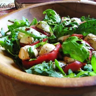 arugula salad in a wooden bowl