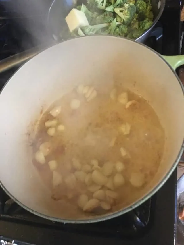 All of the sauce ingredients added to the dutch oven before adding the chicken back