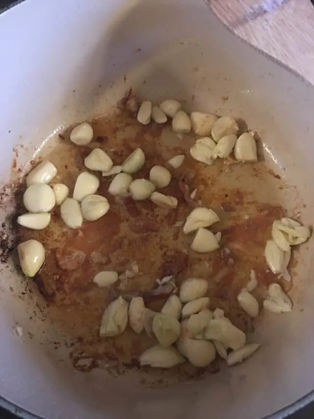 40 cloves of garlic sautéing in the pan