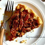 Old Fashion Pecan Pie on a plate with a fork