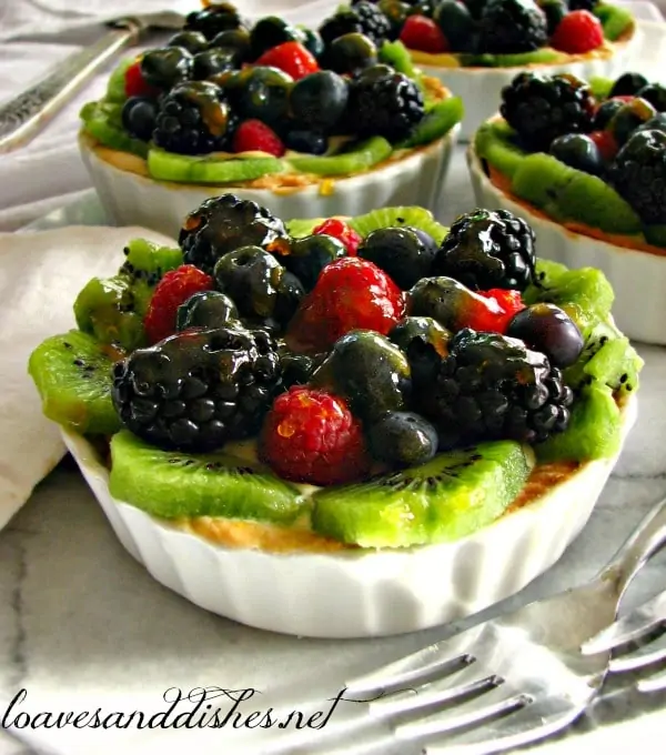 Mini Fruit Tart with kiwi, blackberries, raspberries and blueberries on top