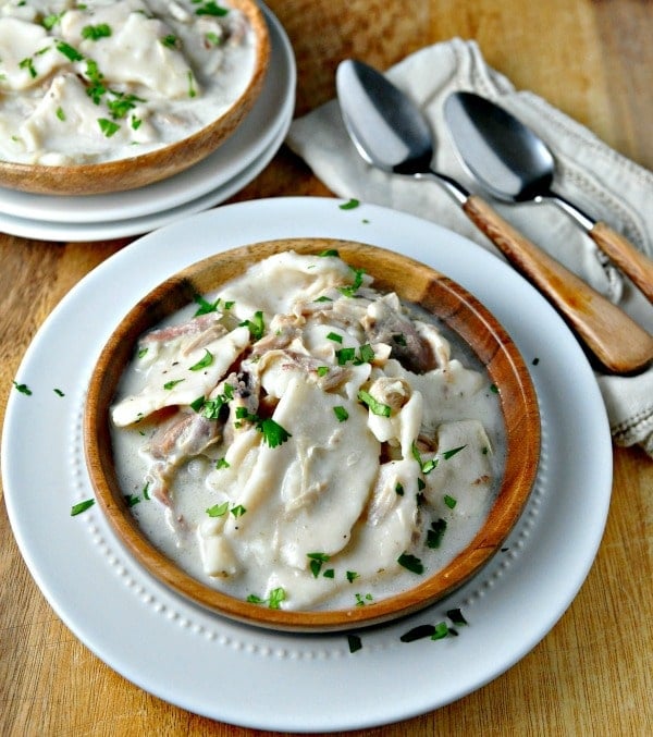 old fashion chicken and dumplins with fresh parsley sprinkled on top