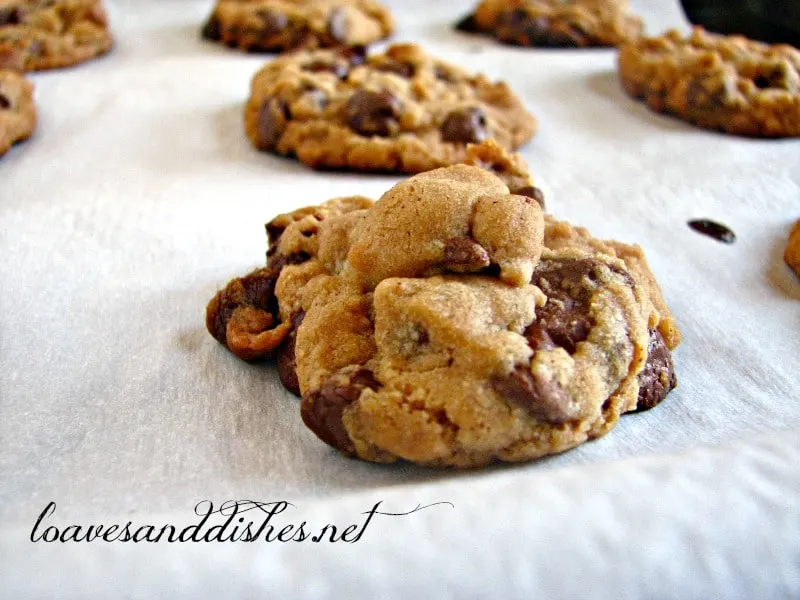 Peanut Butter Chip Chocolate Chip Cookies on parchment papers