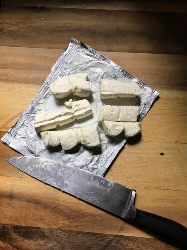 cream cheese cut into 1 inch cubes and knife