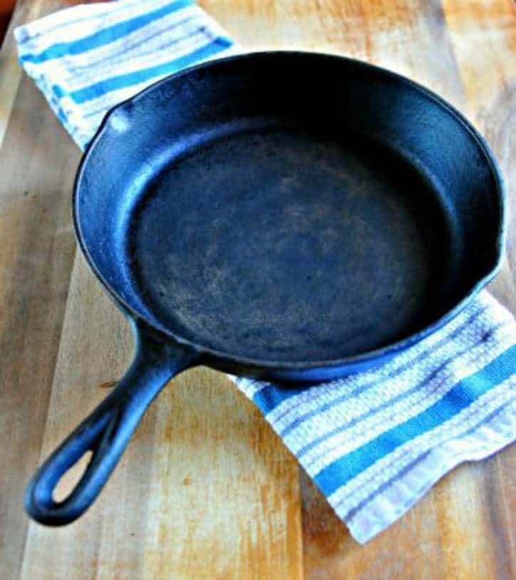 A photo of a rusty skillet on a table