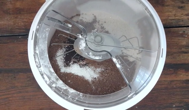All of the dry ingredients added to the bowl of the mixer