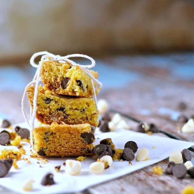 Three cookie bars stacked on each other with string tied around and chips spread out