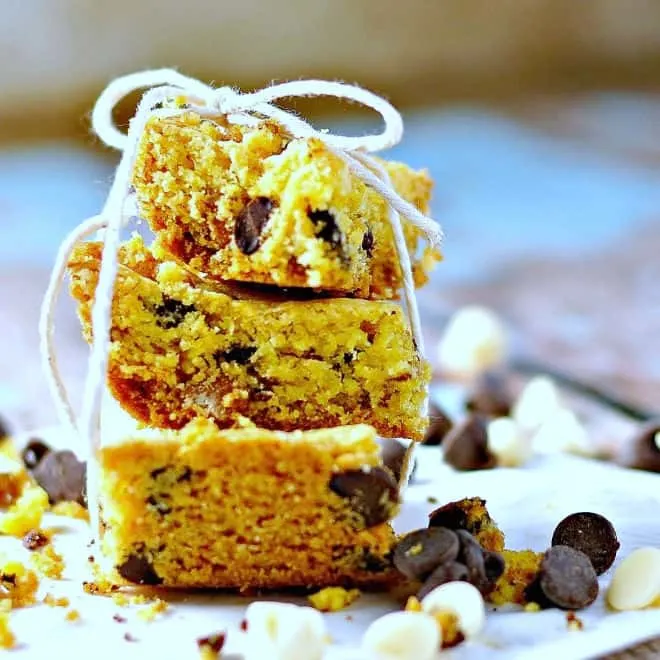 Close up photo of three cookie bars stacked on one another with string tied around