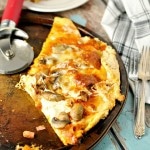 Snow Day Pizza on pizza pan with pizza cutter