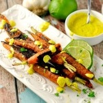 Vindaloo Curry Spiced Carrots with sauce drizzled on top