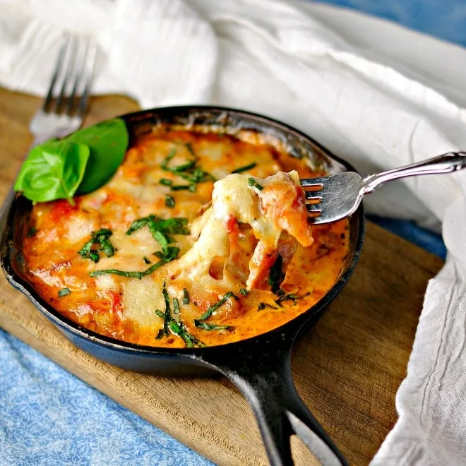 Creamy Cheesy Ham Tomato Sauce with a bite being taken out with a fork