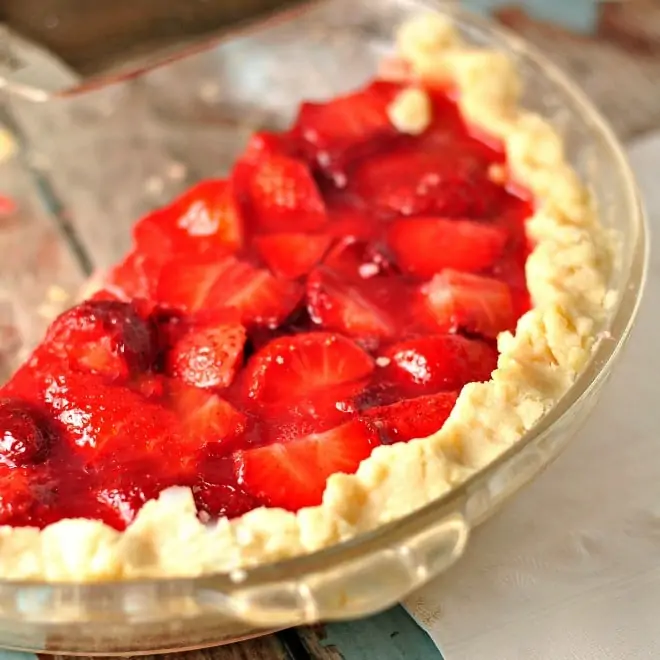 Half of a pie in a glass pie plate