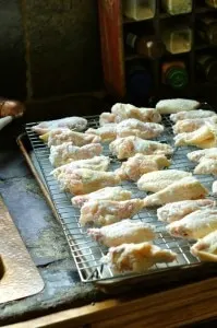 chicken wings on a baking sheet