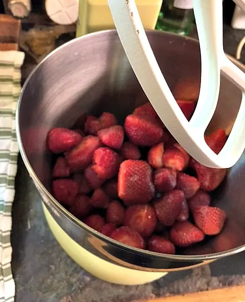 strawberries in the bowl of a mixer