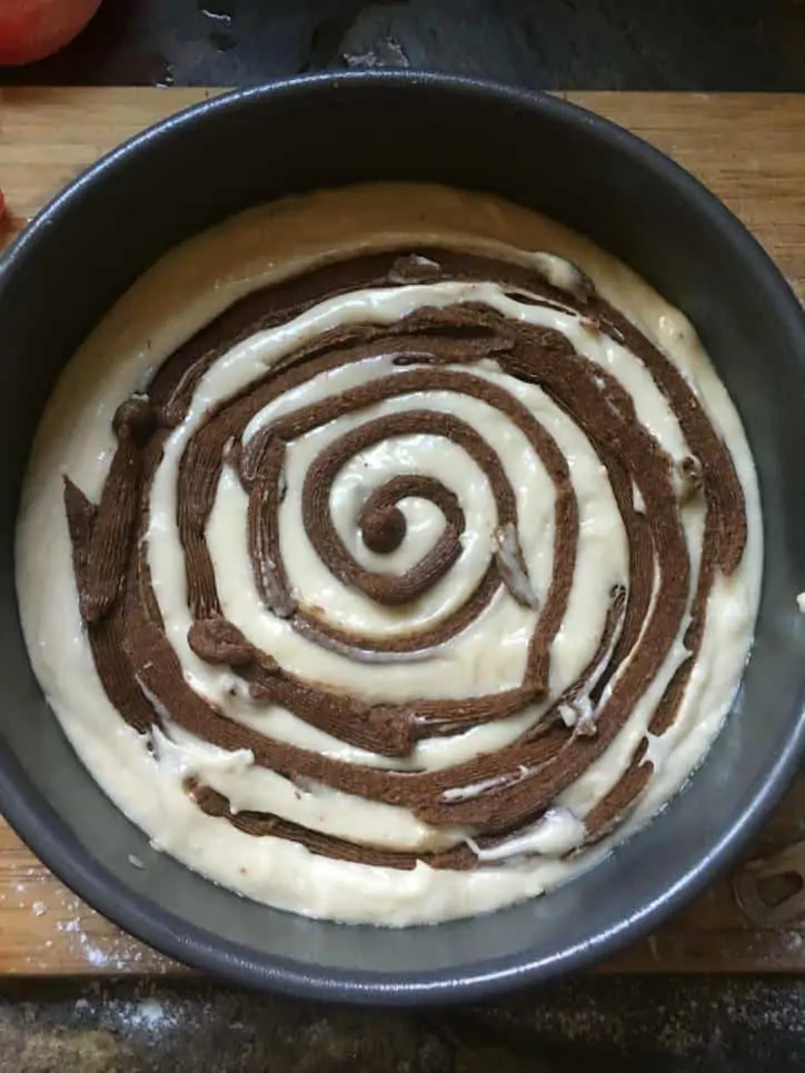 A photo of the fully piped cake for cinnamon roll cake from scratch