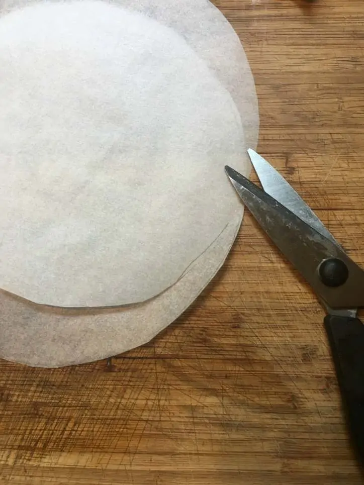 a photo of parchment paper circles for Southern Carrot Cake with Cream Cheese Icing