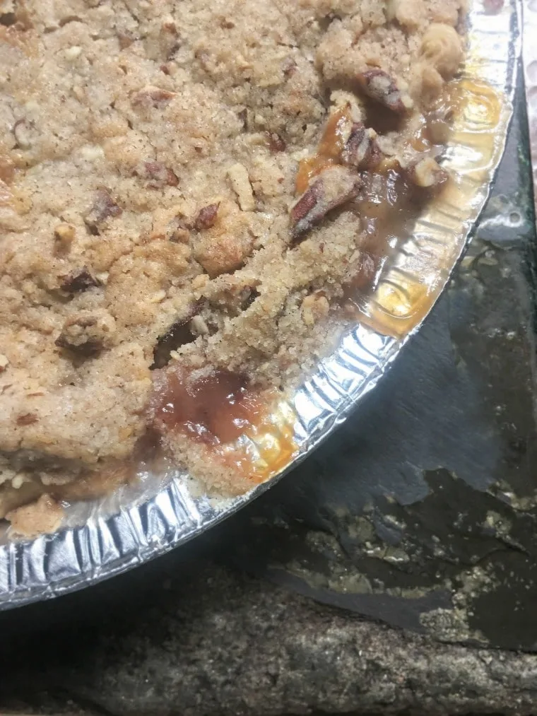 a photo from above of the pie up close Peach Pie with a Pecan Brown Sugar Crumble