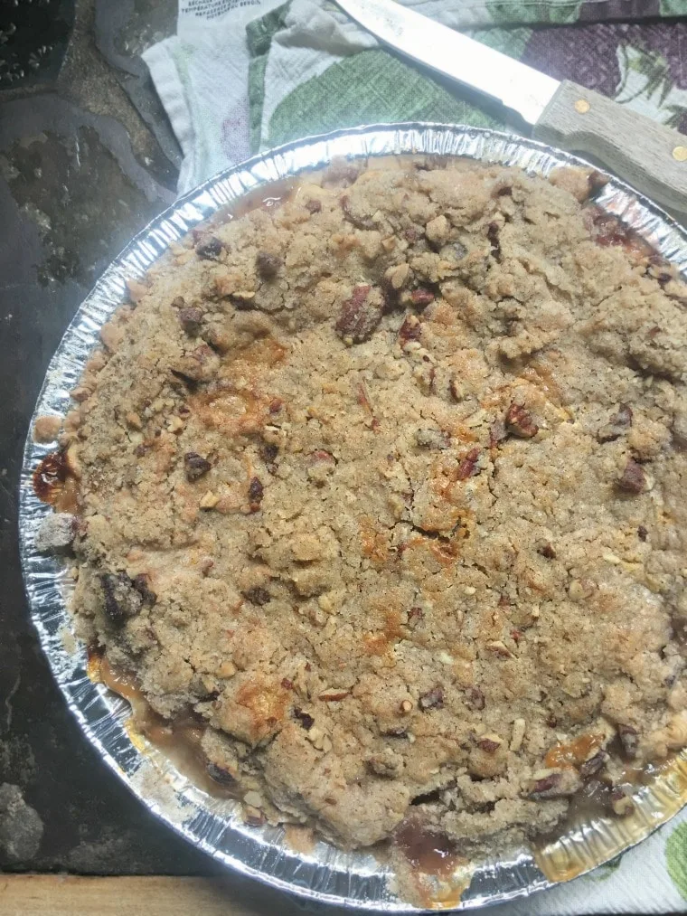 A photo from above of the entire pie Peach Pie with a Pecan Brown Sugar Crumble