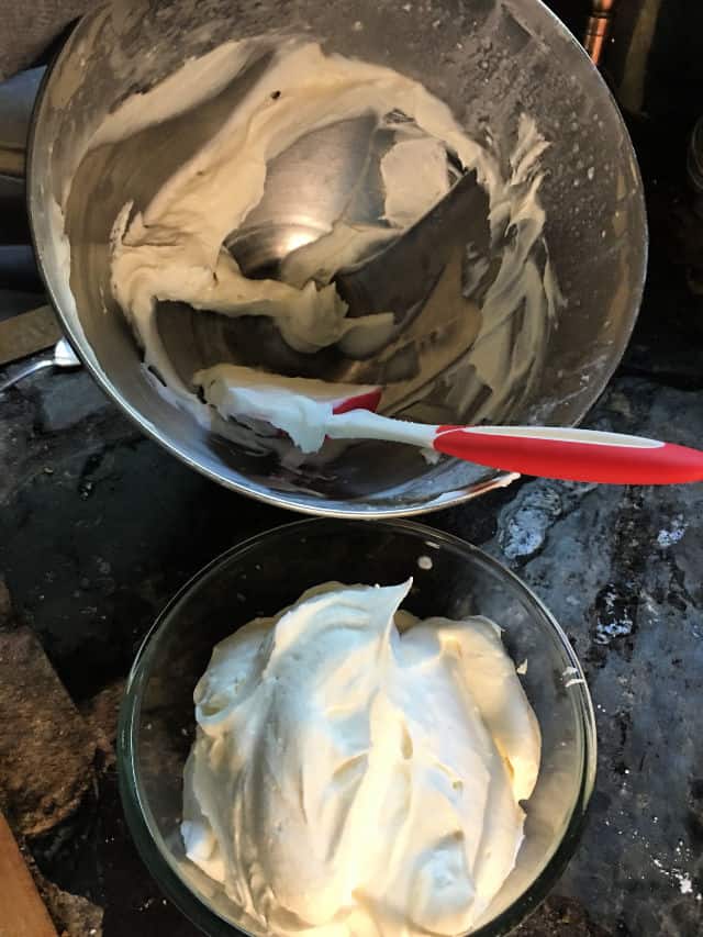 small bowl of fruit dip with larger empty bowl of mixer