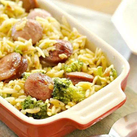 A closeup of a casserole dish of Smoked Sausage and Cheesy Orzo