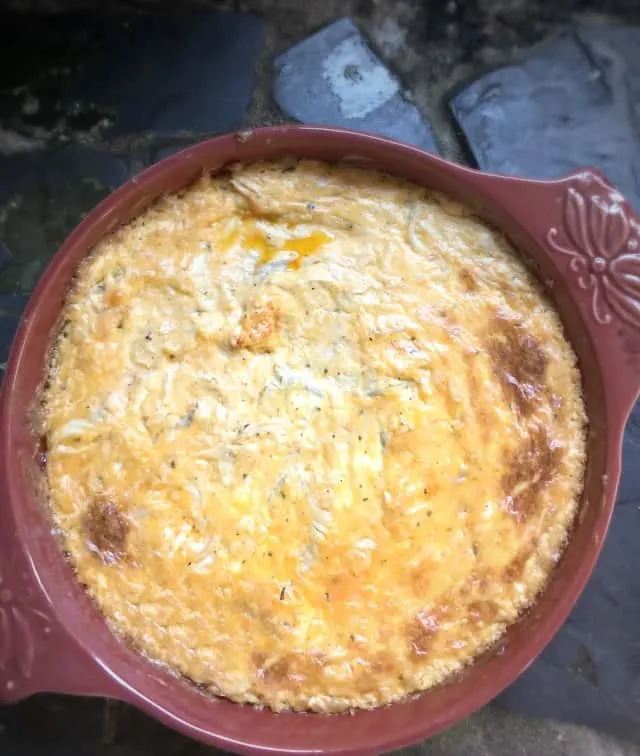 An overhead view of a round dish of buffalo chicken dip