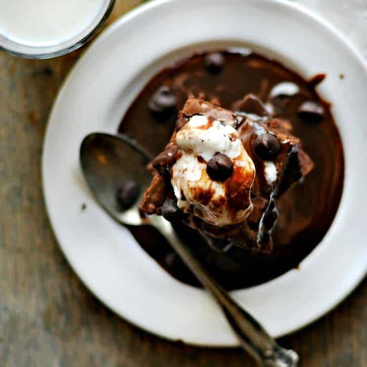 view from above of brownies with chocolate syrup and ice cream on top