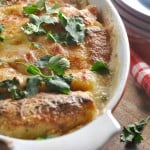 Close up of easy cheesy white chicken enchiladas and cilantro