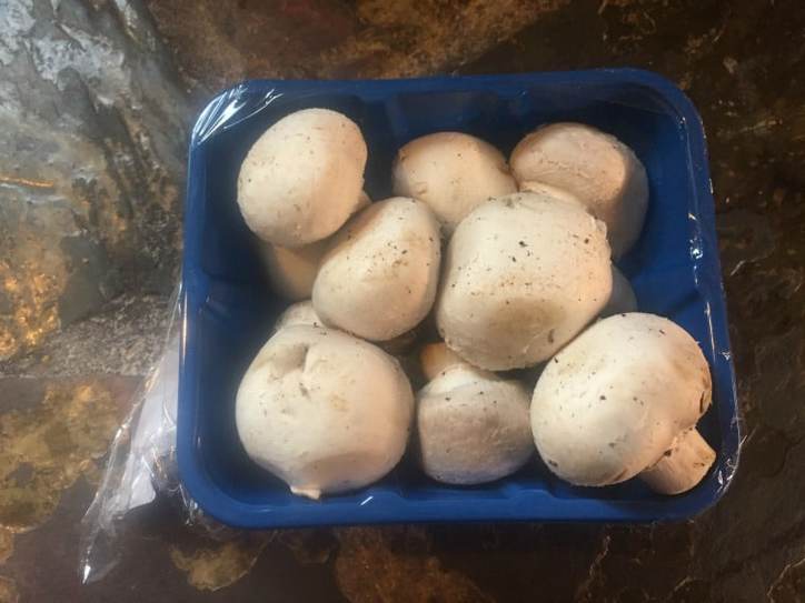 Fresh Button Mushrooms - whole and in the package
