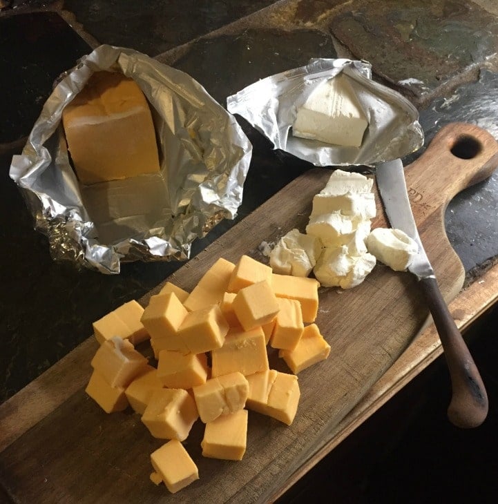 cutting board with cheese and knife