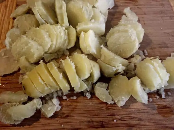 cut up potatoes on a cutting board