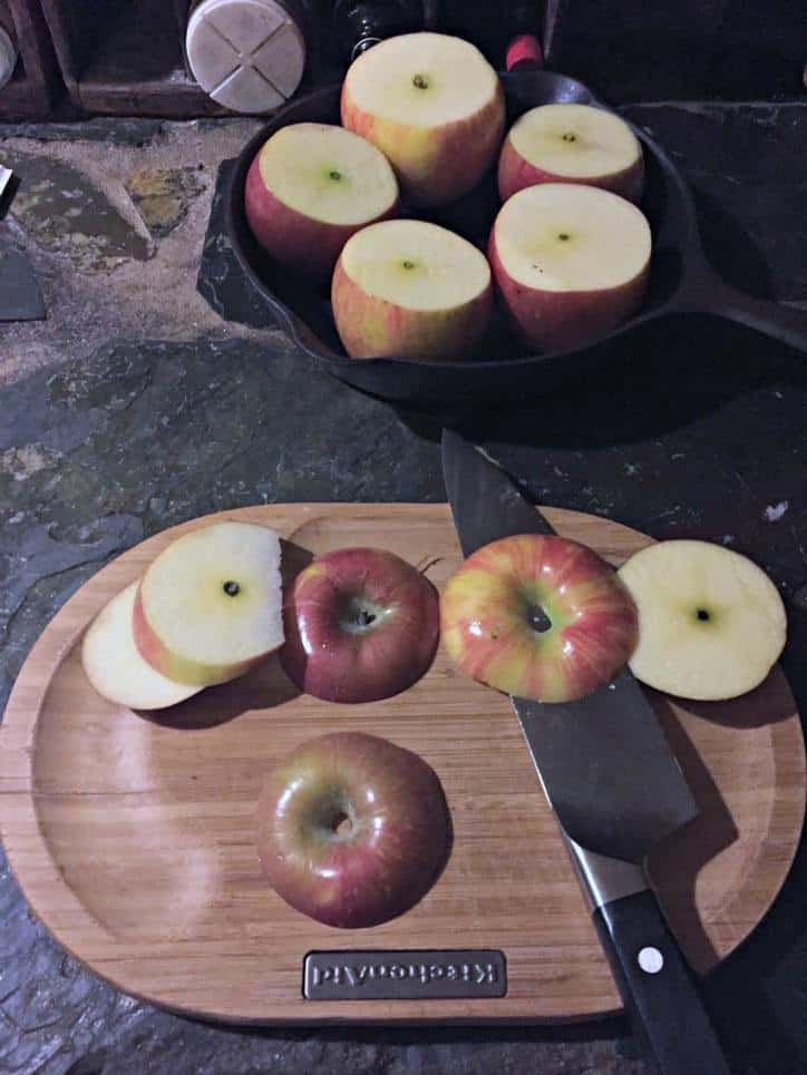 apple tops cut off on cutting board with knife