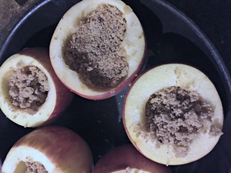 apples in the pan with the brown sugar mix in the center.