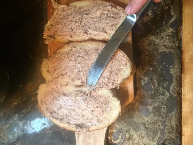 Bread with chocolate butter smeared on it. 