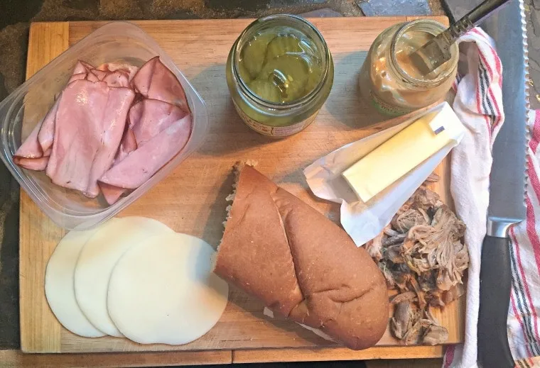 All of the ingredients for the sandwich on a cutting board