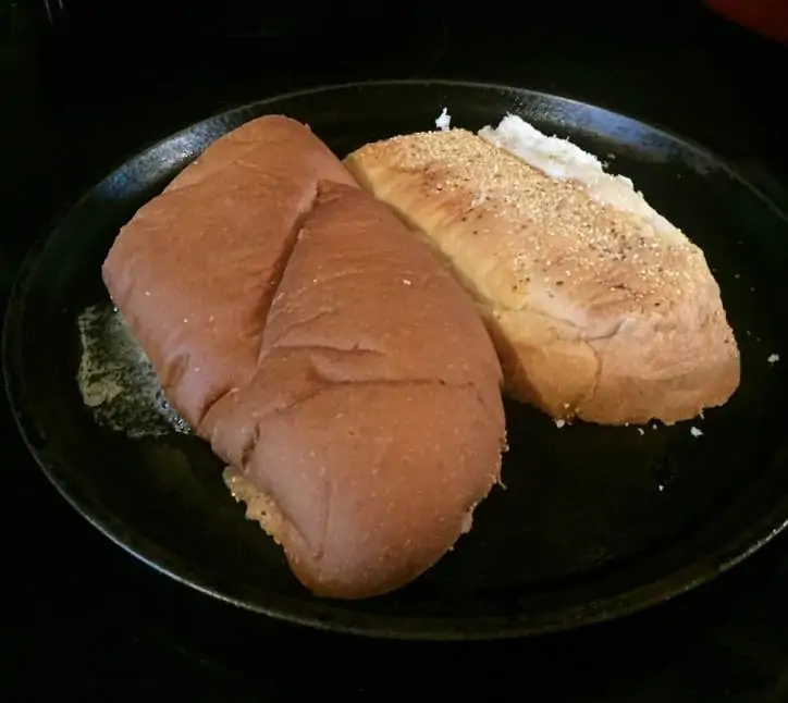 Bread toasting on a cast iron skillet