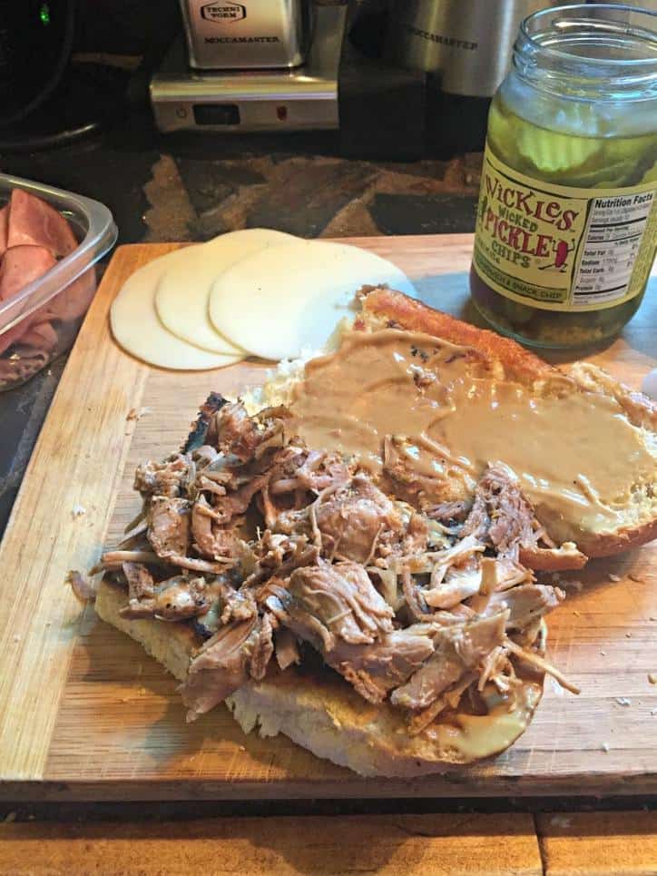 slow cooked pork piled on a sandwich bun