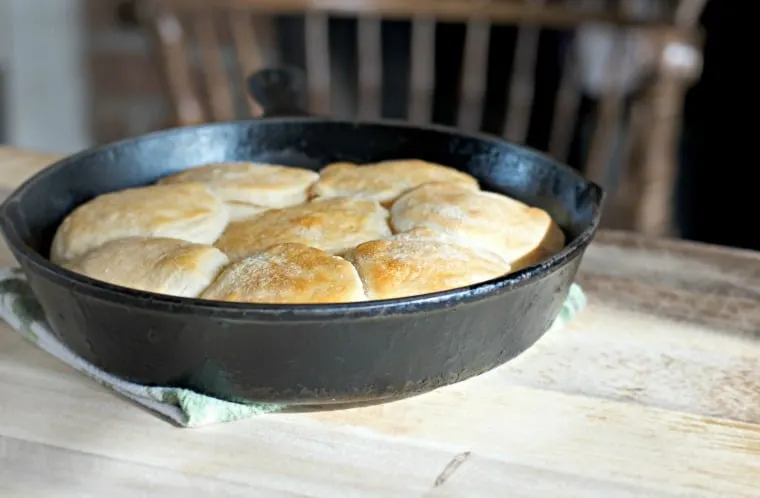 Canned biscuits recipe in skillet on wooden table