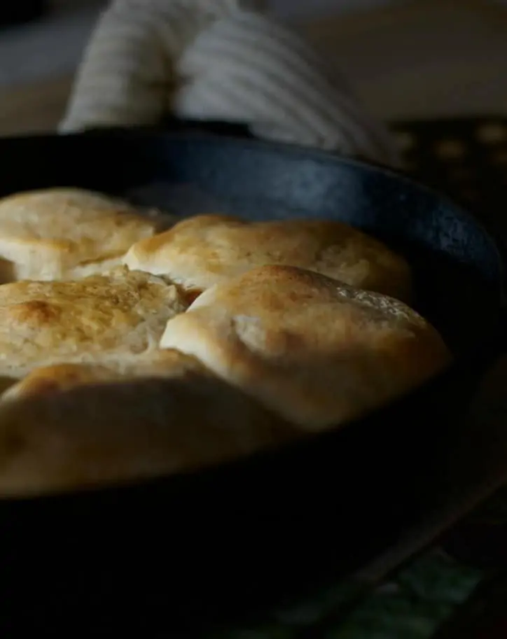 Early morning sunlight glancing across the top of the crusty golden biscuits