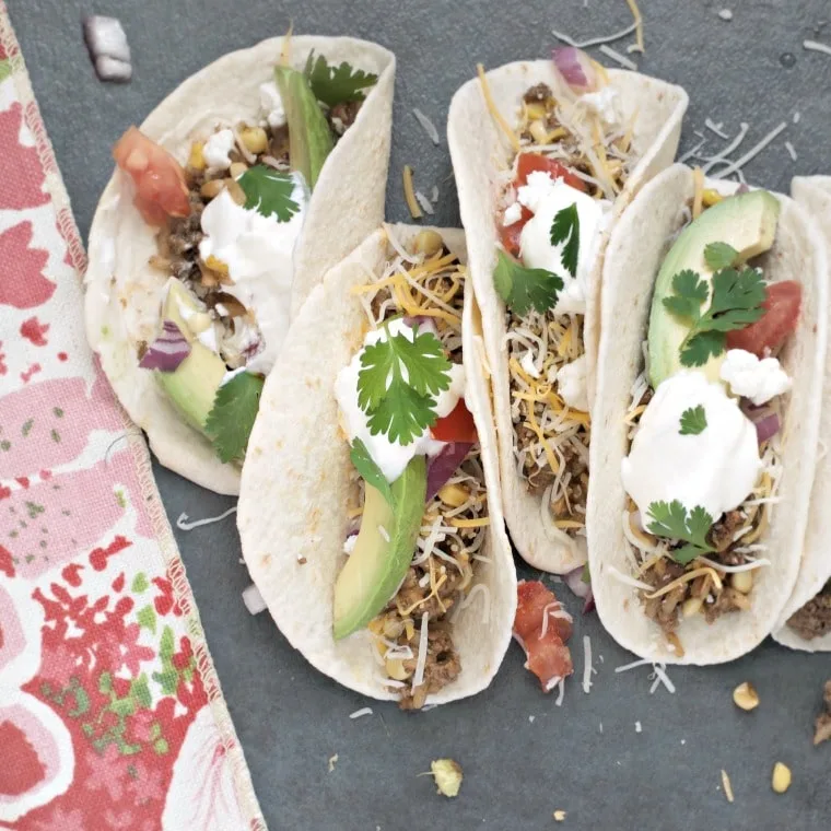 4 carnitas on a gray background with floral towel