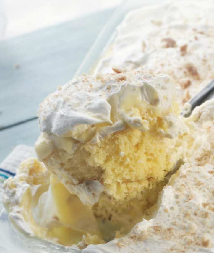 Banana Pudding Poke Cake scooped fully from the pan