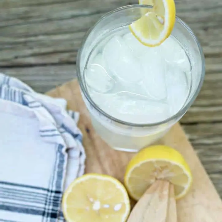 A photo of a cold glass of FRESH HOMEMADE LEMONADE CONCENTRATE from the top