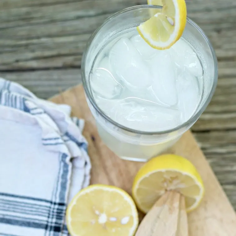 A photo of a cold glass of FRESH HOMEMADE LEMONADE CONCENTRATE from the top