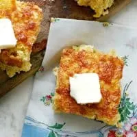 Southern Mexican Cornbread with a cute floral napkin beneath and butter on top