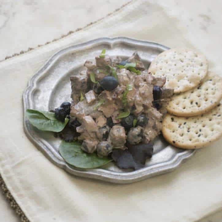 Blueberry Balsamic Chicken Salad on a pewter plate with green fresh lettuce