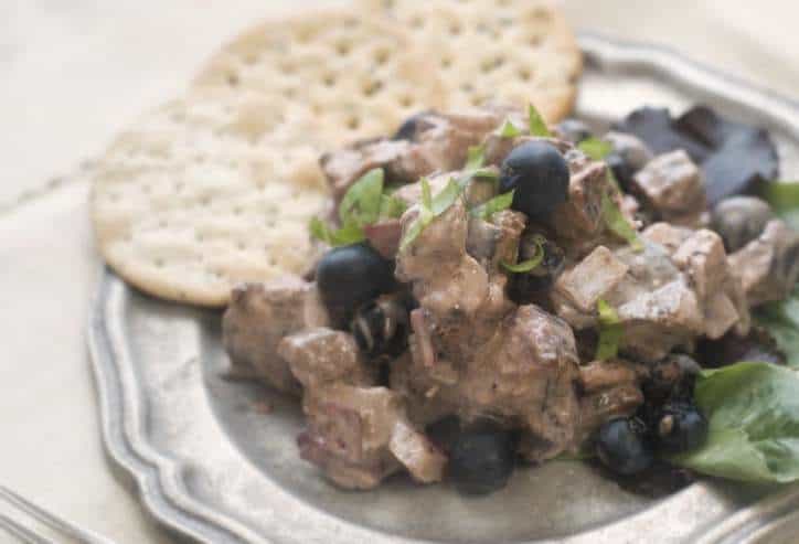 Blueberry Balsamic Chicken Salad close up photo with three crackers in the background